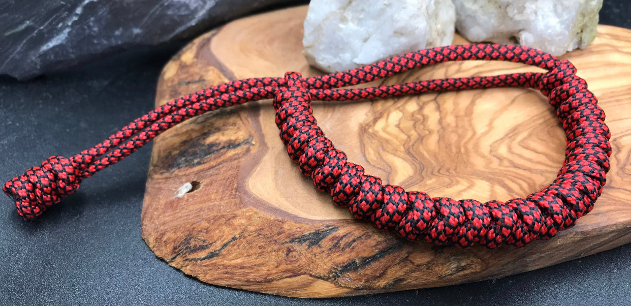 Paracord Bracelet in a red diamond patterned colour snake knott design made in the U.K to be lightweight strong and compfortable