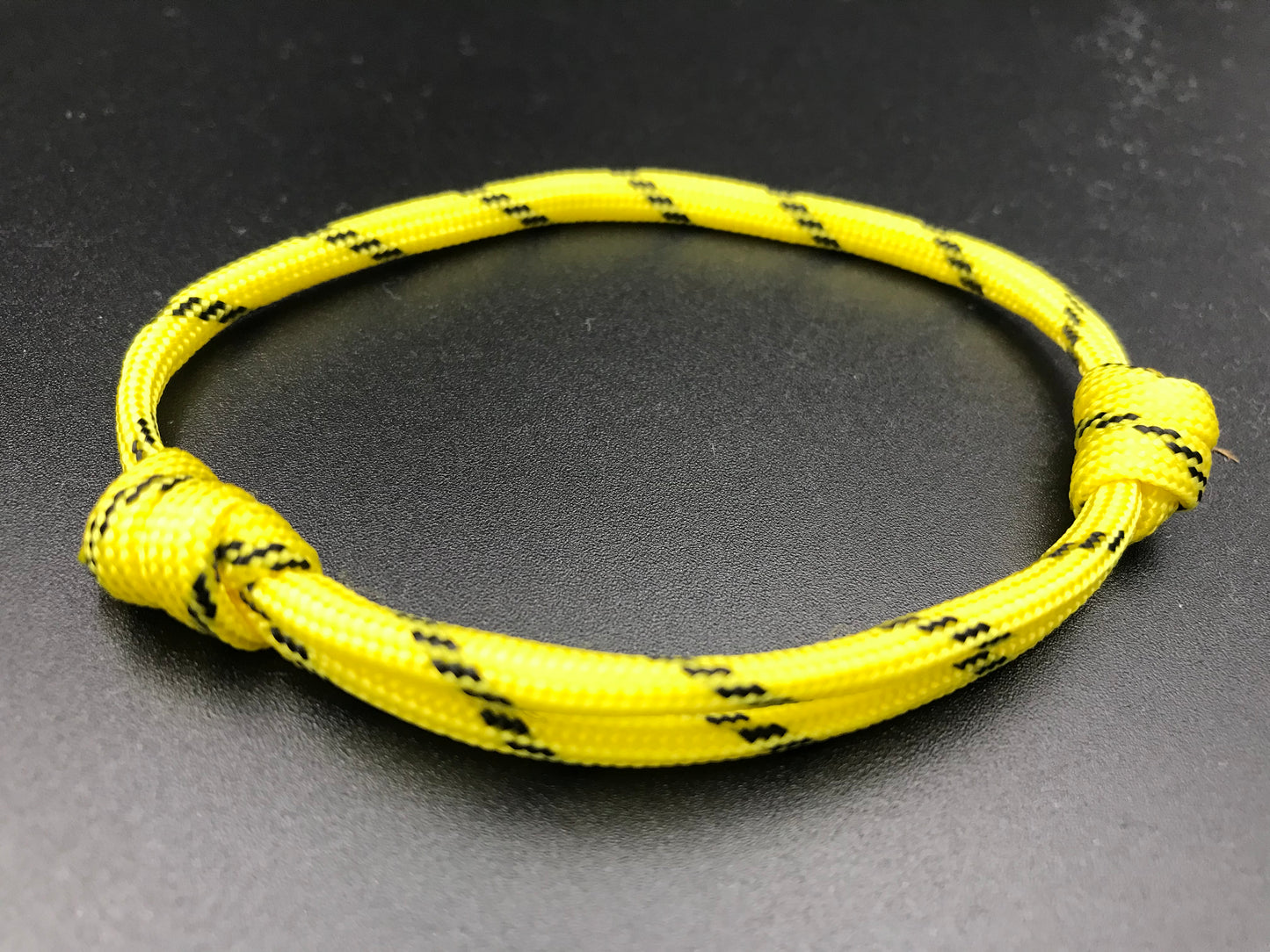 Paracord Friendship bracelet in yellow with black stripes lightweight and fully adjustable 