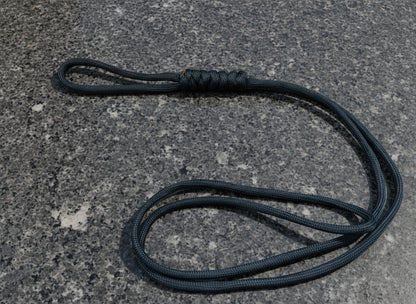 Black rope on a textured gray surface
