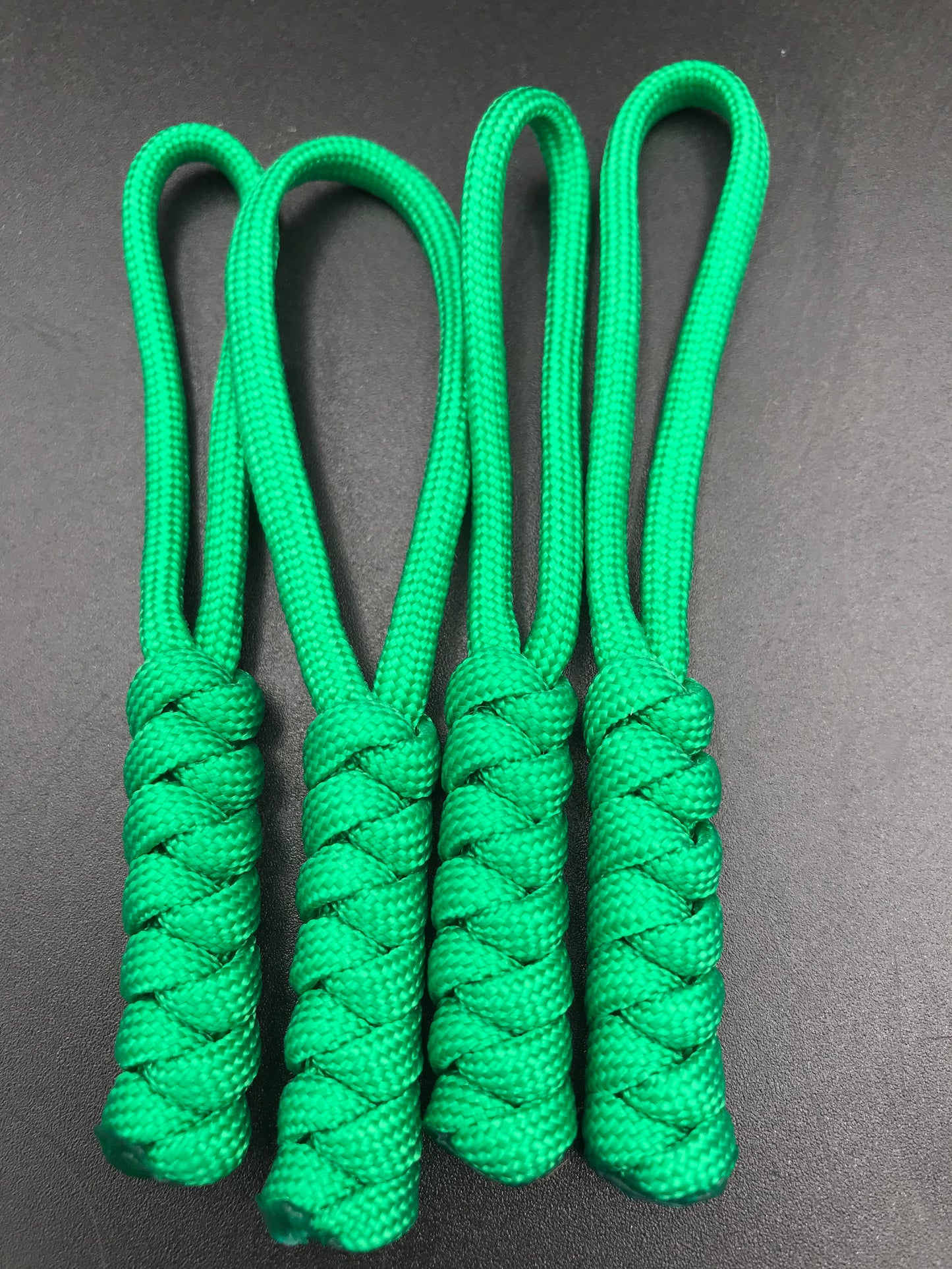 Paracord zip pulls in grass green (4 pack) light weight, strong and hand crafted in U.K