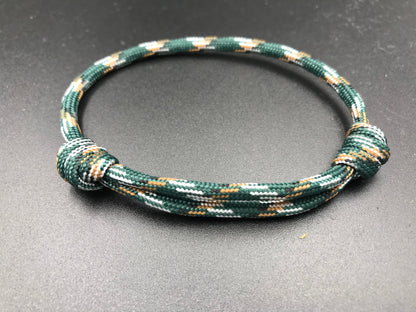 Paracord friendship bracelet In urban camo ( dark green light brown and white ) light weight and fully adjustable