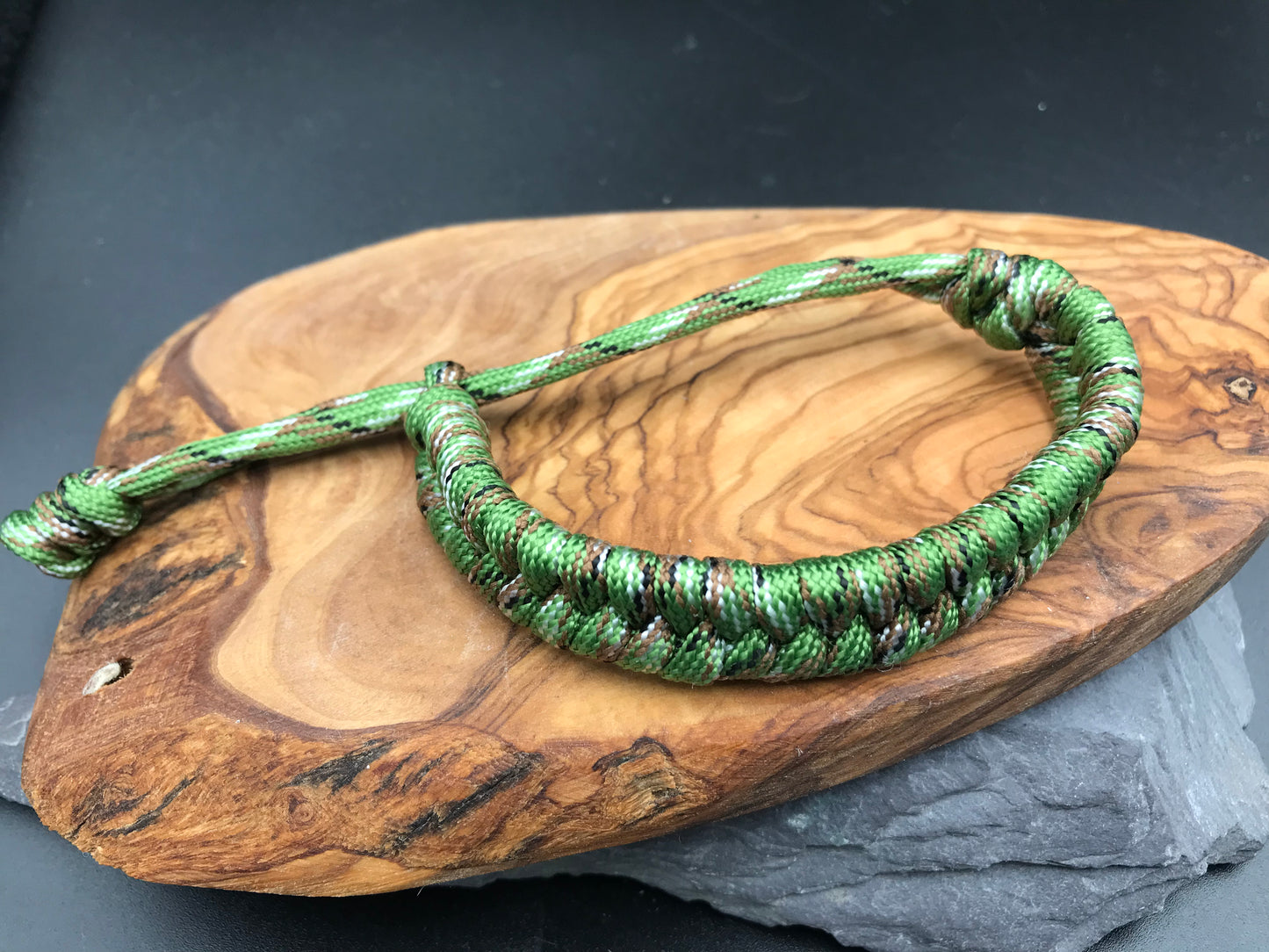 Handmade Paracord Fishtail weave bracelet in Forest green camo a mix of greens and some brown