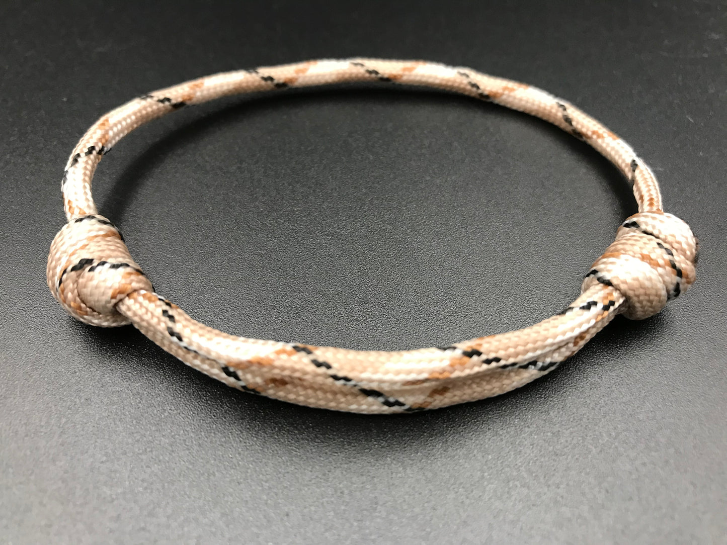 Paracord friendship bracelet in Desert camo ( light brown medium brown military camo mixes) light weight and fully adjustable 