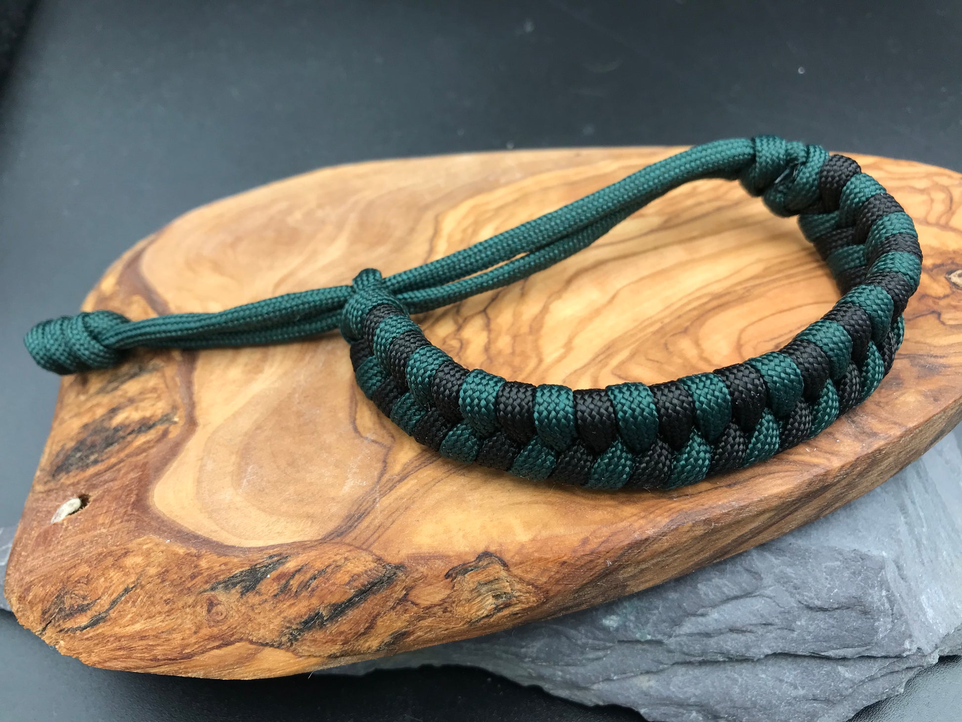 Handmade Paracord Fishtail weave bracelet in Black and emerald green colour
